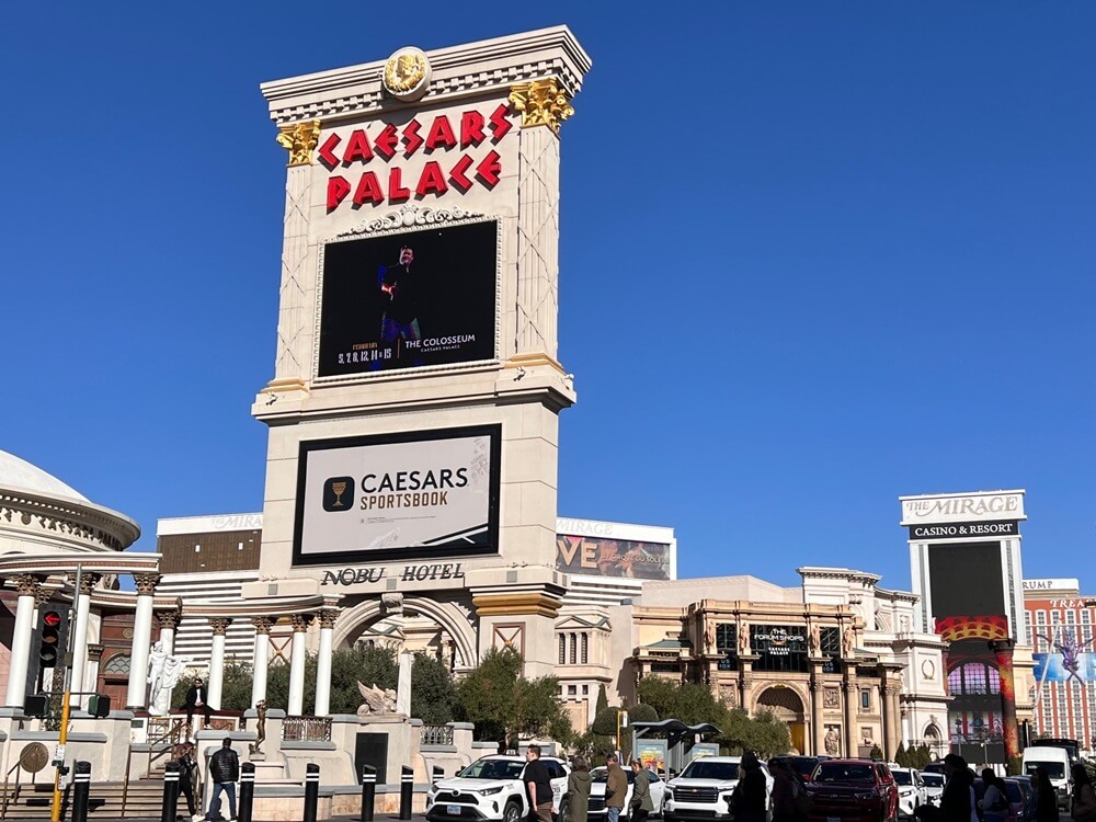 Caesars Palace Las Vegas with bright signage and clear blue skies, captured during UK entrepreneur Andrew Scott’s business trip and conference visit.